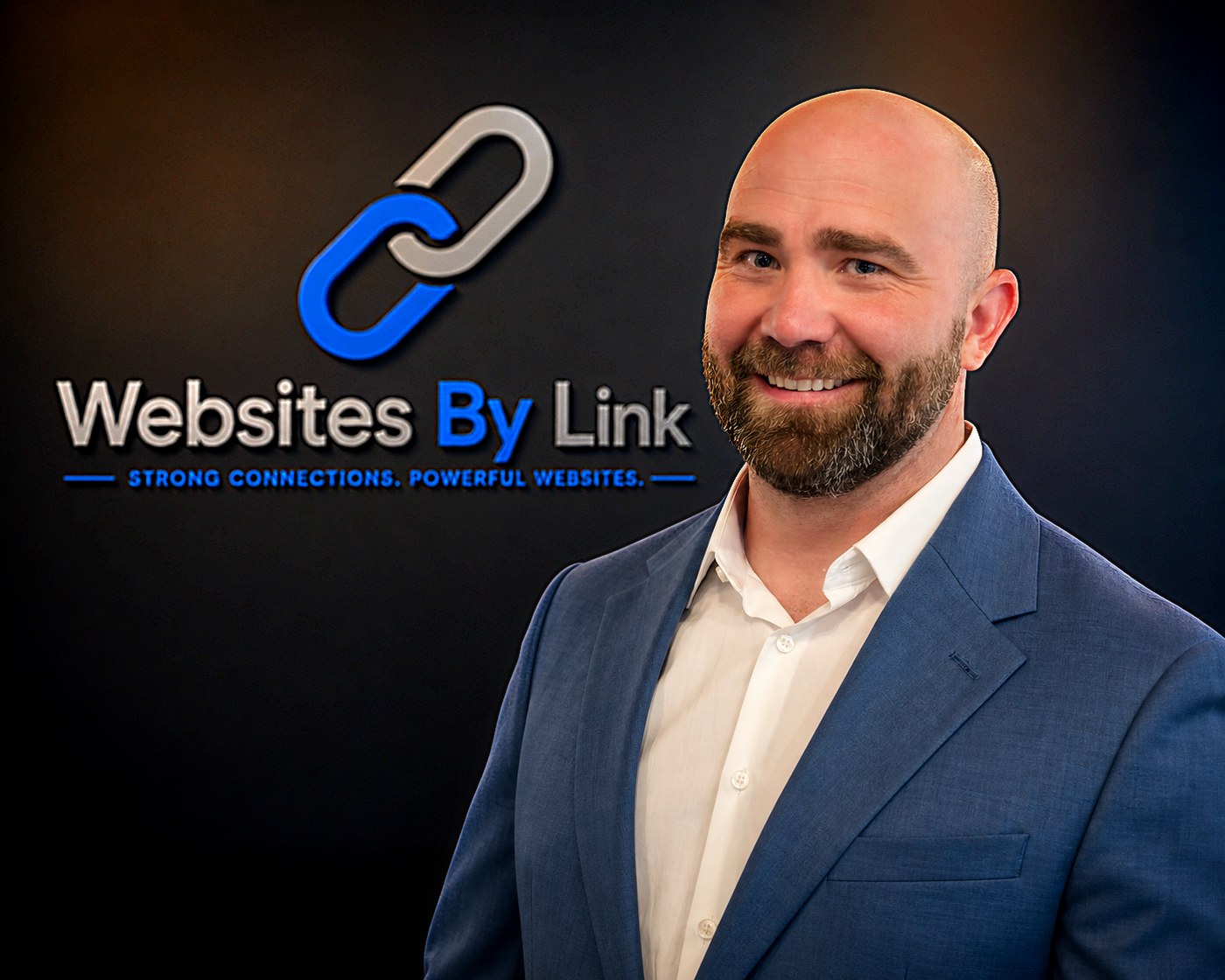 Dustin Link, founder of Websites By Link, in front of the company logo